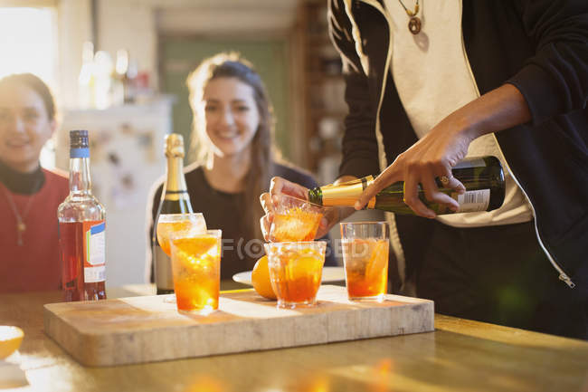 Young adult friends making cocktails — Stock Photo