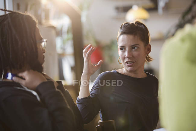 College students talking indoors — Stock Photo