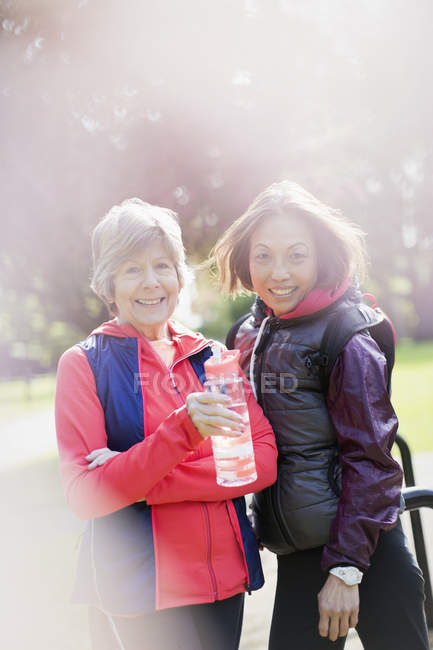 Portrait smiling, confident active senior women in park — Stock Photo