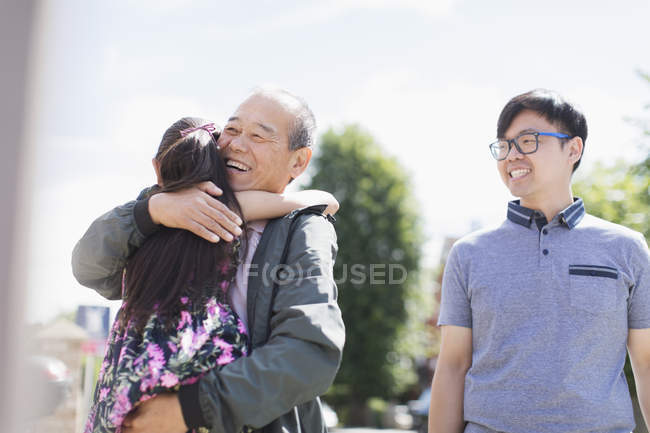 Affectionate grandfather and granddaughter hugging — Stock Photo