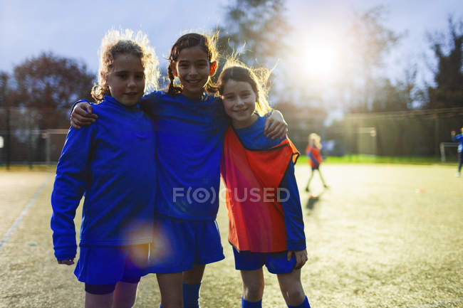 Portrait smiling, confident girl soccer players — Stock Photo