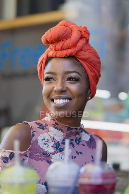 Smiling young woman wearing headscarf — Stock Photo