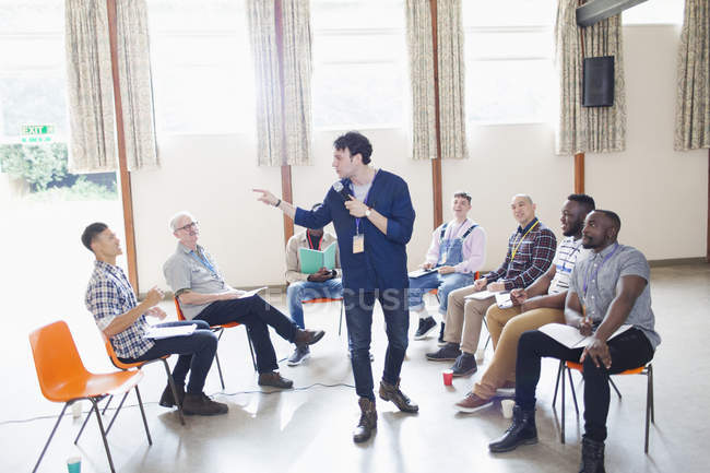Man talking, leading group therapy — Stock Photo