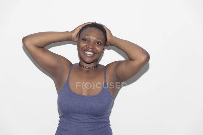 Portrait confident, carefree woman with hands behind head — Stock Photo