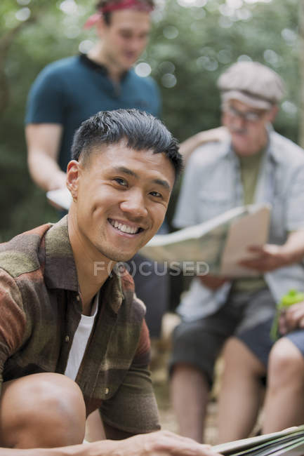 Portrait confident man with map, preparing for hike — Stock Photo