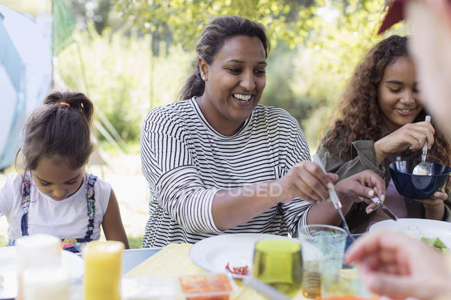 Family enjoying lunch at campsite — Stock Photo