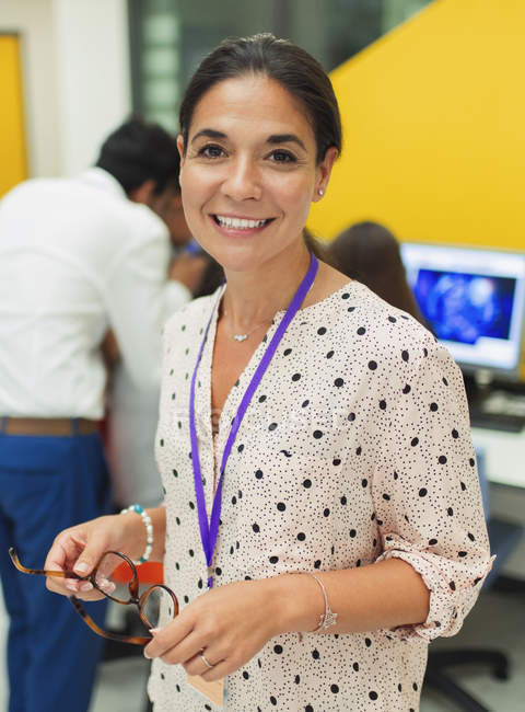 Portrait of smiling, confident female teacher — Stock Photo