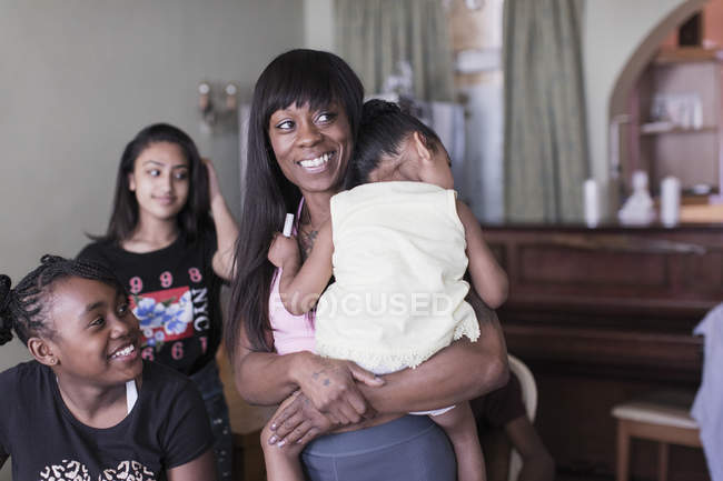 Happy mother and children at home — Stock Photo