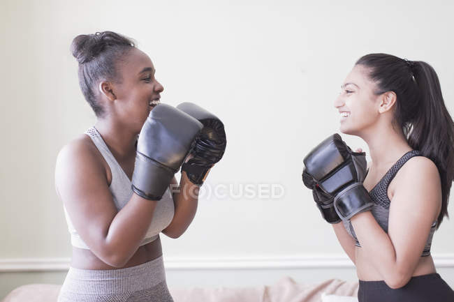 Tween girls boxing at home — Stock Photo