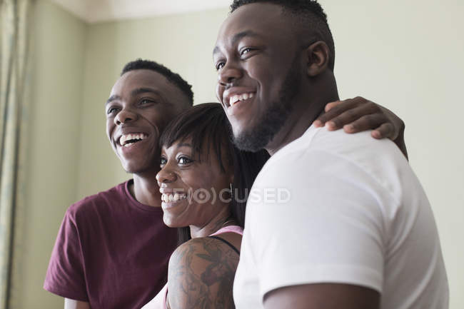 Portrait affectionate mother and teenage sons — Stock Photo