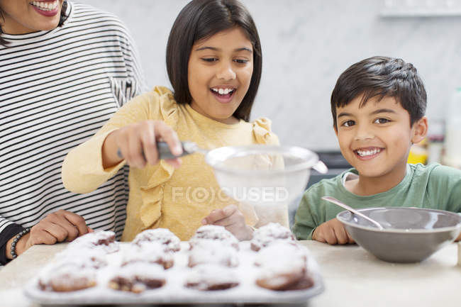 Portrait happy family baking in kitchen — Stock Photo