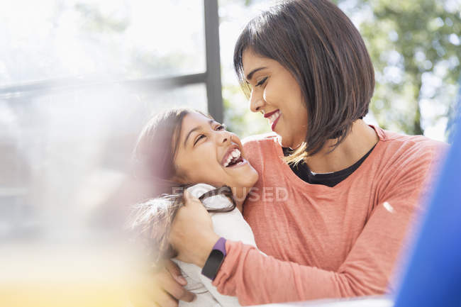 Happy, affectionate mother and daughter hugging — Stock Photo