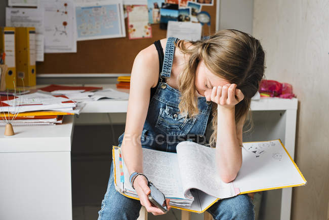 Tired, stressed female college student studying — Stock Photo