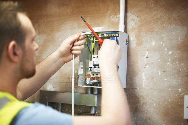 Male electrician student practicing in workshop — Stock Photo