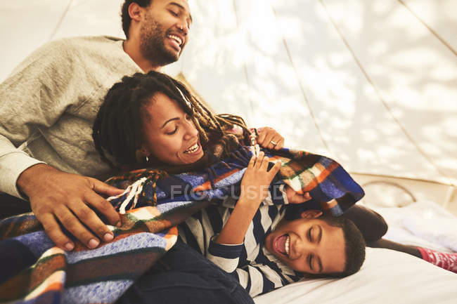 Playful family in camping yurt — Stock Photo