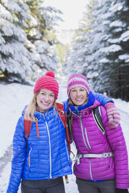 Portrait of women hiking in snow — Stock Photo