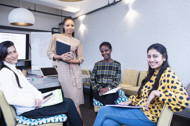 Portrait confident businesswomen in conference room meeting — Stock Photo