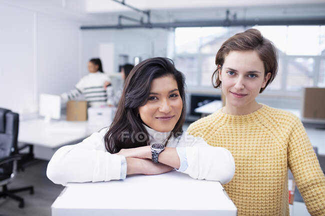 Portrait confident businesswomen in new office — Stock Photo