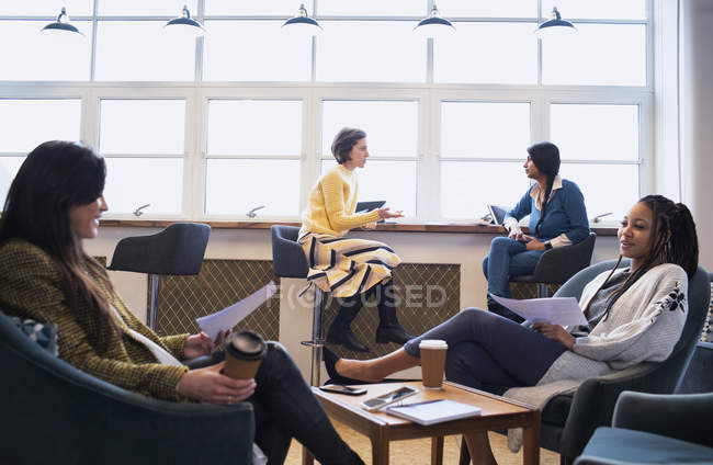 Businesswomen talking in office — Stock Photo
