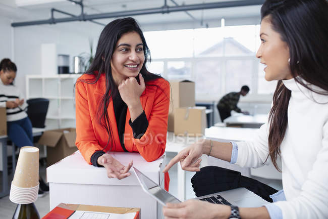 Businesswomen talking in new office — Stock Photo