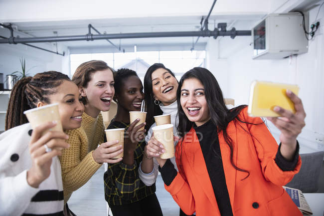 Happy businesswomen celebrating, taking selfie — Stock Photo