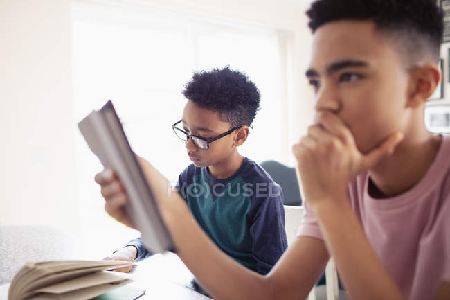 Teenage boys doing homework — Stock Photo