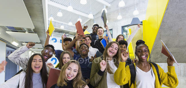 Portrait excited junior high students cheering — Stock Photo
