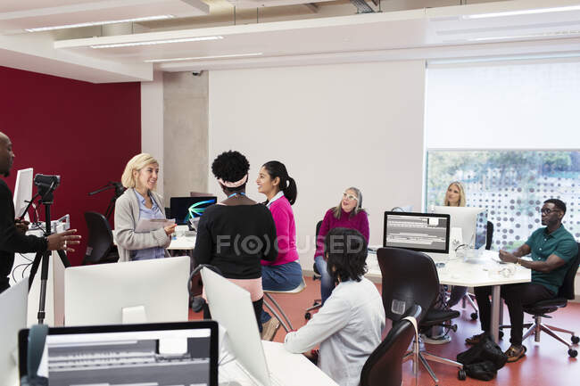 Journalism students filming in classroom — Stock Photo