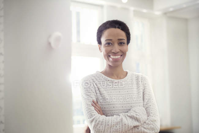 Portrait confident, smiling woman with arms crossed — Stock Photo