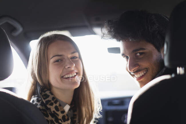 Portrait happy young couple in car — Stock Photo