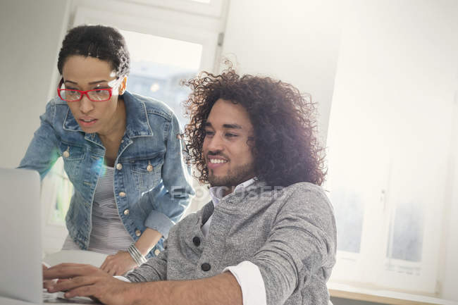 Couple using laptop in room — Stock Photo