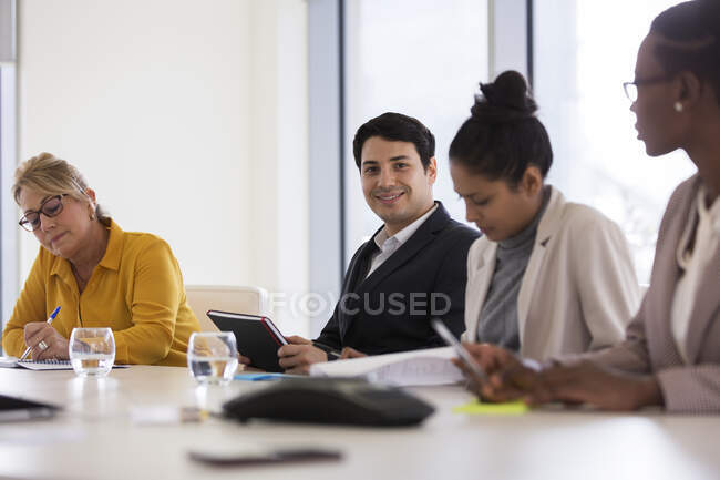 Portrait confident businessman in conference room meeting — Stock Photo