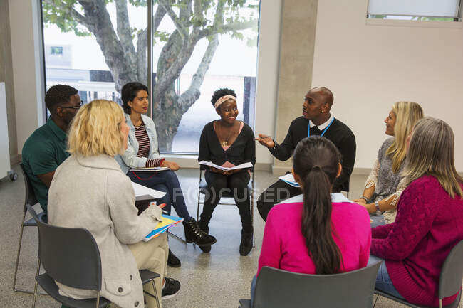 People talking in support group meeting circle — Stock Photo