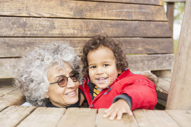 Portrait playful grandmother and toddler grandson — Stock Photo