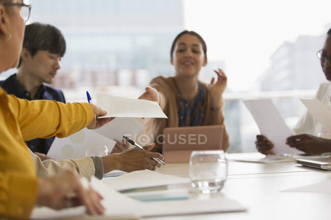 Business people discussing paperwork in conference room meeting — Stock Photo