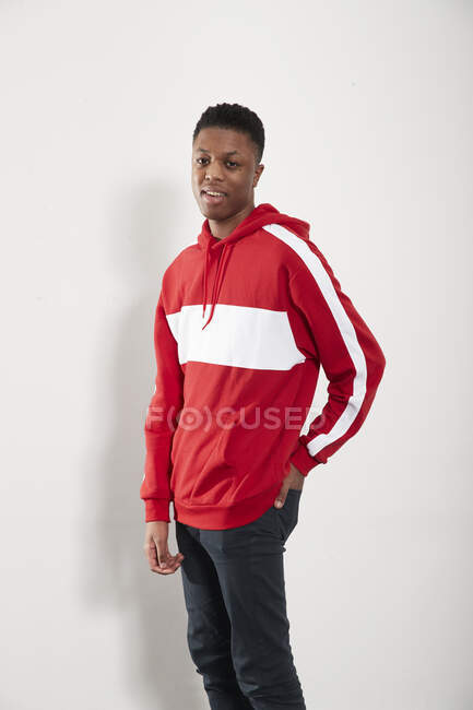 Portrait confident young man in hoody — Stock Photo