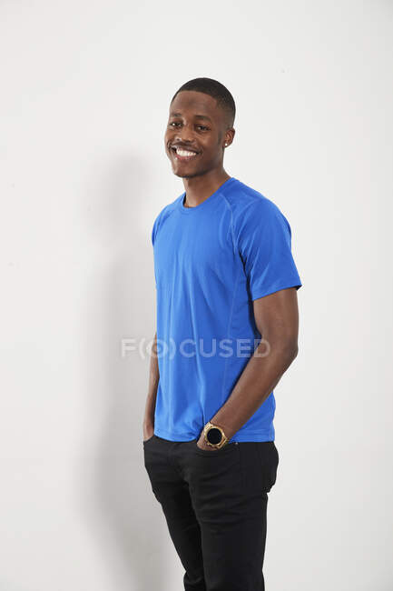 Portrait happy young man in blue t-shirt — Stock Photo