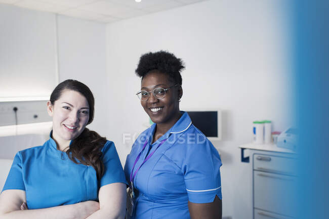 Portrait confident female nurses in hospital room — Stock Photo