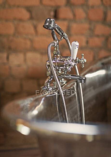 Home showcase interior stainless steel soaking tub faucet — Stock Photo