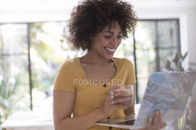 Happy young female freelancer working at laptop — Stock Photo