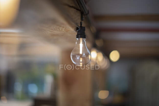 Water filling clear light bulb — Stock Photo