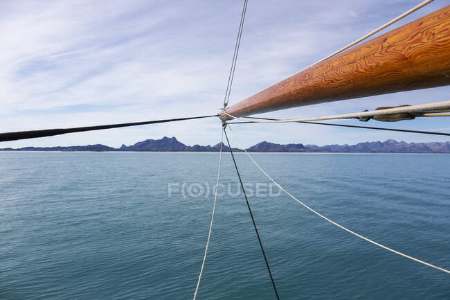 Wooden sailboat mast over sunny blue Atlantic Ocean Greenland — Stock Photo