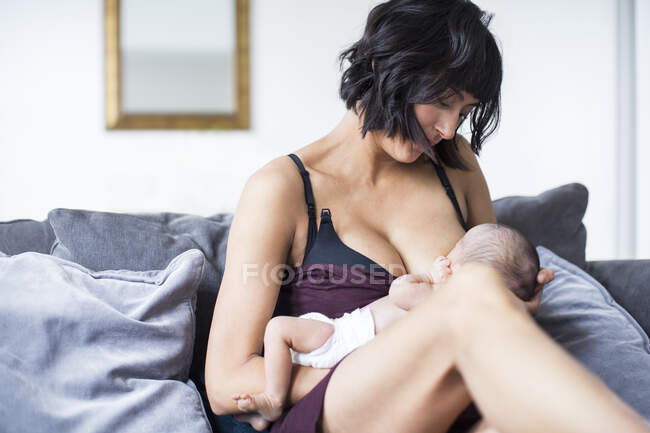 Mother breastfeeding newborn baby son — Stock Photo