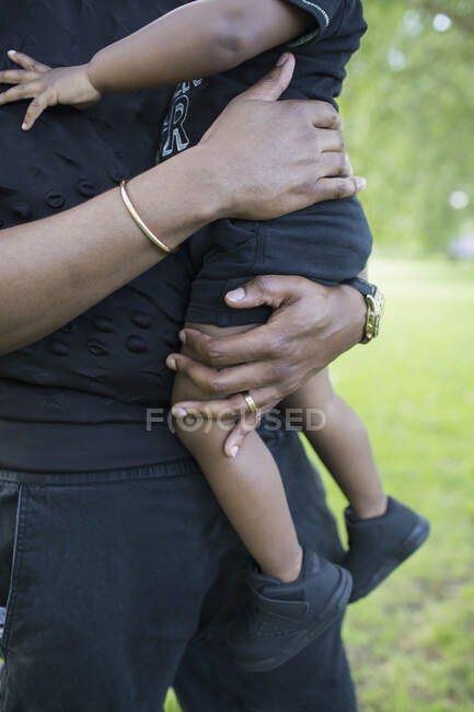 Father holding toddler son — Stock Photo
