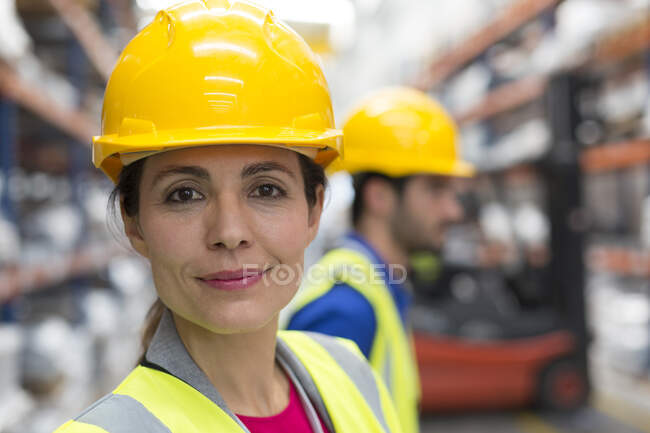 Portrait confident female worker in warehouse — Stock Photo