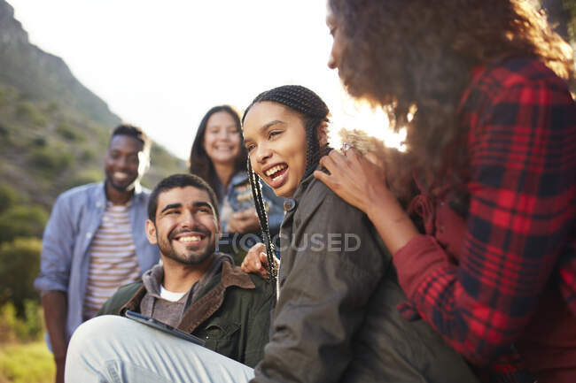 Young friends laughing, hanging out — Stock Photo