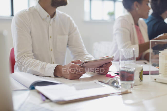 Male architect using digital tablet in conference room meeting — Stock Photo
