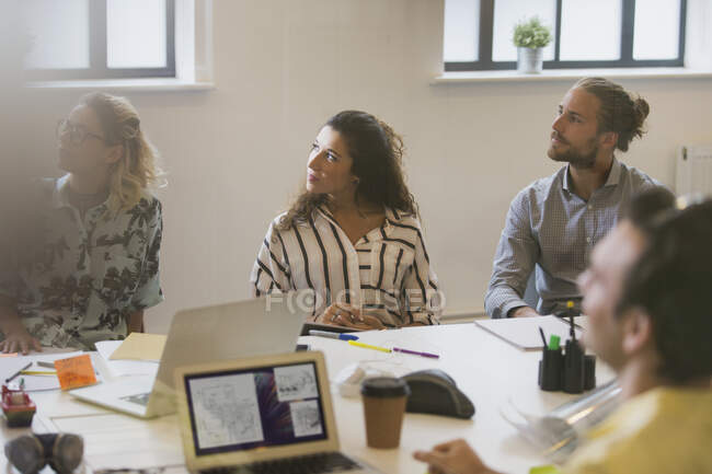 Attentive designers listening in conference room meeting — Stock Photo