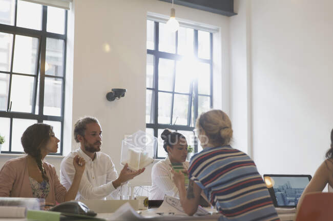 Architects examining model in conference room meeting — Stock Photo