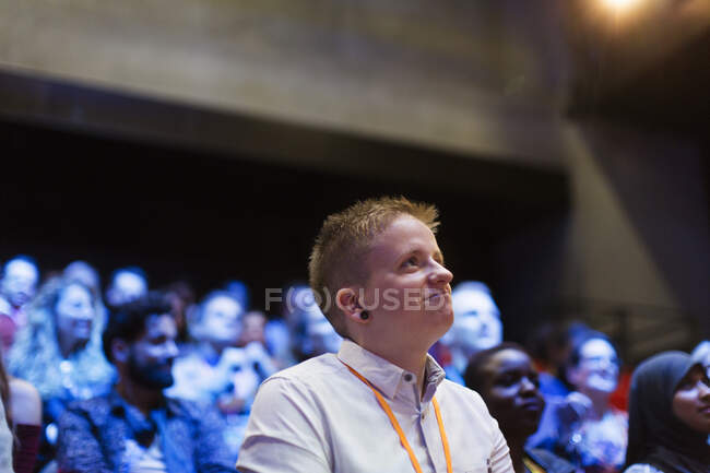 Attentive woman listening in conference audience — Stock Photo